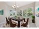 Formal dining room with large windows, stylish lighting, and ample seating at 9760 Innisbrook Blvd, Carmel, IN 46032