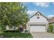 Charming home featuring a two-car garage, landscaped yard, and beautiful brick accents at 9760 Innisbrook Blvd, Carmel, IN 46032