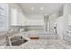 Modern kitchen with granite countertops, white cabinets, and stainless steel appliances at 9760 Innisbrook Blvd, Carmel, IN 46032