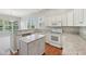 Bright kitchen features granite countertops, white cabinetry, and stainless steel appliances at 9760 Innisbrook Blvd, Carmel, IN 46032