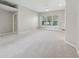 Bright and airy living room with large windows offering beautiful outdoor views at 9760 Innisbrook Blvd, Carmel, IN 46032