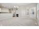 Cozy living room shows an open layout with access to the kitchen and fireplace at 9760 Innisbrook Blvd, Carmel, IN 46032