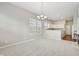 Open-concept living space provides a dining area, fireplace, and kitchen views at 9760 Innisbrook Blvd, Carmel, IN 46032