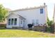 The backyard features the house, a grill, and retaining wall at 10773 Brighton Knoll S Pkwy, Noblesville, IN 46060