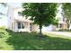 Well-maintained two-story home with a lush green lawn and a charming front porch at 10773 Brighton Knoll S Pkwy, Noblesville, IN 46060