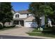 Charming two-story home with a brick-accented garage and a neatly kept front lawn at 10773 Brighton Knoll S Pkwy, Noblesville, IN 46060