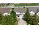 Charming two-story home with a brick-accented garage and mature trees along the front driveway at 10773 Brighton Knoll S Pkwy, Noblesville, IN 46060