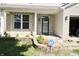 The home has a small front porch, a brick facade, and manicured landscaping at 10773 Brighton Knoll S Pkwy, Noblesville, IN 46060