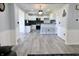 Inviting eat-in kitchen featuring a bar, stainless steel appliances and updated cabinets at 10773 Brighton Knoll S Pkwy, Noblesville, IN 46060