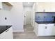 Clean kitchen featuring white cabinets, dark countertops, and stainless steel appliances with light-colored walls at 10773 Brighton Knoll S Pkwy, Noblesville, IN 46060