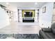 Comfortable living room with custom built-in shelves and an electric fireplace at 10773 Brighton Knoll S Pkwy, Noblesville, IN 46060