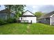 Back of house view showing a deck, siding, and yard, nestled in a neighborhood at 1148 N Pershing Ave, Indianapolis, IN 46222