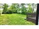 Lush backyard with ample green space and a charming deck area for outdoor relaxation at 1148 N Pershing Ave, Indianapolis, IN 46222