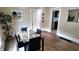 Elegant dining room with modern table set, neutral walls, and contemporary artwork for a stylish touch at 1148 N Pershing Ave, Indianapolis, IN 46222