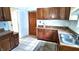 Well-equipped kitchen showcasing wood cabinets, granite-look countertops, and a convenient double sink at 1148 N Pershing Ave, Indianapolis, IN 46222