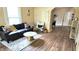 Cozy living room with modern furniture, light walls, and hardwood flooring at 1148 N Pershing Ave, Indianapolis, IN 46222