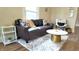 Cozy living room with modern furniture, light walls, and hardwood flooring at 1148 N Pershing Ave, Indianapolis, IN 46222