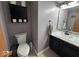 Efficient bathroom featuring toilet, cabinet, vanity with a large mirror, and counter space at 1214 Lindsey Ln, Lebanon, IN 46052