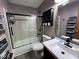 Functional bathroom featuring shower-tub combo, cabinet, and ample counter space at 1214 Lindsey Ln, Lebanon, IN 46052
