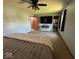 Comfortable bedroom with en-suite bathroom, plush carpet, and a modern TV at 1214 Lindsey Ln, Lebanon, IN 46052
