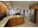Kitchen showcases stainless steel appliances and transitions into a dining area at 1214 Lindsey Ln, Lebanon, IN 46052