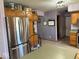 Kitchen showcases stainless steel appliances, wood cabinets, tile flooring, and lavender walls at 1214 Lindsey Ln, Lebanon, IN 46052