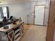 Open-concept living area featuring modern console, front door, and neutral decor at 1214 Lindsey Ln, Lebanon, IN 46052