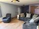 Inviting living room features a comfortable sectional sofa and chair for relaxation at 1214 Lindsey Ln, Lebanon, IN 46052