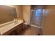 Functional bathroom featuring a single vanity, toilet, and shower with glass door at 123 Old Farm Rd, Danville, IN 46122