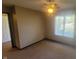 Comfortable carpeted bedroom with ceiling fan and window for ample natural light at 123 Old Farm Rd, Danville, IN 46122