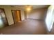 This is a spacious bedroom with neutral carpet, ceiling fan, and good natural light from the window at 123 Old Farm Rd, Danville, IN 46122