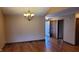 Dining area featuring hardwood floors, elegant lighting, and a view into adjacent rooms at 123 Old Farm Rd, Danville, IN 46122