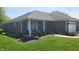 Charming brick home featuring a manicured lawn, inviting porch, and attached garage at 123 Old Farm Rd, Danville, IN 46122