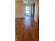 Inviting living room with hardwood flooring and a view of the front entrance, creating a warm and welcoming atmosphere at 123 Old Farm Rd, Danville, IN 46122