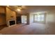 Inviting living room with fireplace, carpet flooring, large window, and neutral color palette at 123 Old Farm Rd, Danville, IN 46122