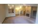 Bright and airy living room with a vaulted ceiling, fireplace, and a view into the kitchen at 123 Old Farm Rd, Danville, IN 46122
