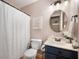 This bathroom boasts a stylish vanity, decorative mirror, and modern fixtures, creating a serene and functional space at 12446 Deerview Dr, Noblesville, IN 46060