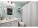 This bathroom has a white vanity, a round mirror, and modern fixtures, offering a clean and bright space at 12446 Deerview Dr, Noblesville, IN 46060