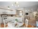 Bright, white eat-in kitchen with modern appliances, ample cabinet space and an open floor plan at 12446 Deerview Dr, Noblesville, IN 46060