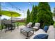 This patio features comfortable outdoor seating, a dining area, and lush greenery, perfect for relaxation and entertaining at 12446 Deerview Dr, Noblesville, IN 46060