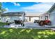 Large deck with outdoor dining, hot tub, and stylish lounge area overlooking the lawn at 12681 E 79Th St, Indianapolis, IN 46236