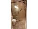 Bathroom featuring a shower, tile floors, and a modern toilet at 12681 E 79Th St, Indianapolis, IN 46236