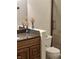 Bathroom vanity with dark granite countertop and shower with glass door at 12681 E 79Th St, Indianapolis, IN 46236