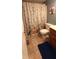 Bathroom featuring floral shower curtain and tiled floor at 12681 E 79Th St, Indianapolis, IN 46236