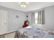 Comfortable bedroom with rocking chair and natural light through the window at 12681 E 79Th St, Indianapolis, IN 46236