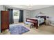 Elegant bedroom featuring neutral carpet, a window, and a crystal chandelier at 12681 E 79Th St, Indianapolis, IN 46236