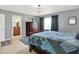 Elegant bedroom featuring neutral carpet, a window, and an ensuite bathroom at 12681 E 79Th St, Indianapolis, IN 46236