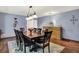 Traditional dining room with dark wood table, seating for eight, and patterned accent rug at 12681 E 79Th St, Indianapolis, IN 46236