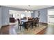 Open floor plan showcases dining room with dark wood table and view into living room at 12681 E 79Th St, Indianapolis, IN 46236