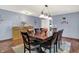 Traditional dining room with dark wood table, seating for eight, and decorative buffet at 12681 E 79Th St, Indianapolis, IN 46236